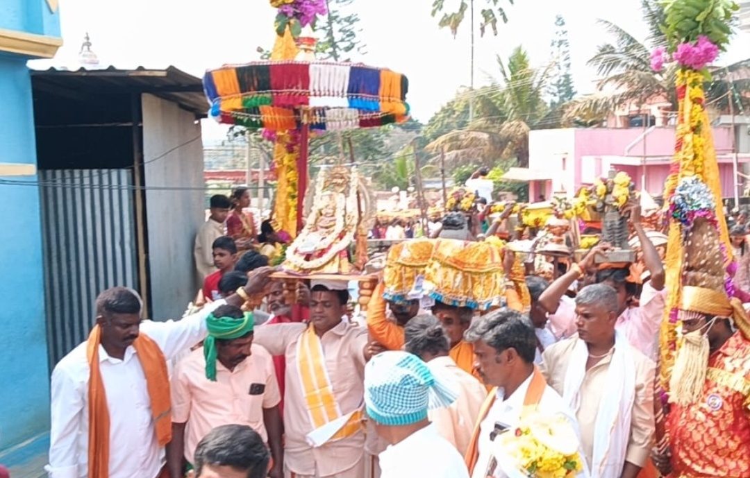 Devotees carrying Amman in the festival procession